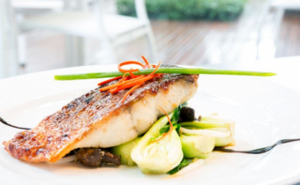 Crispy skin barramundi on Asian greens