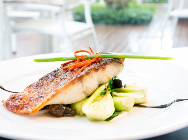 Crispy skin barramundi on Asian greens