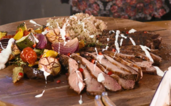 Butterflied leg of lamb with baked veg