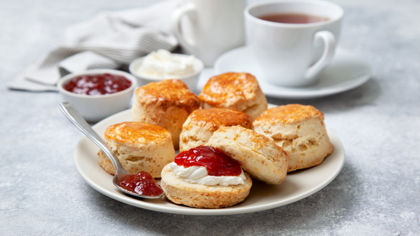 Scones,On,A,White,Plate,,A,Jar,Of,Strawberry,Jam