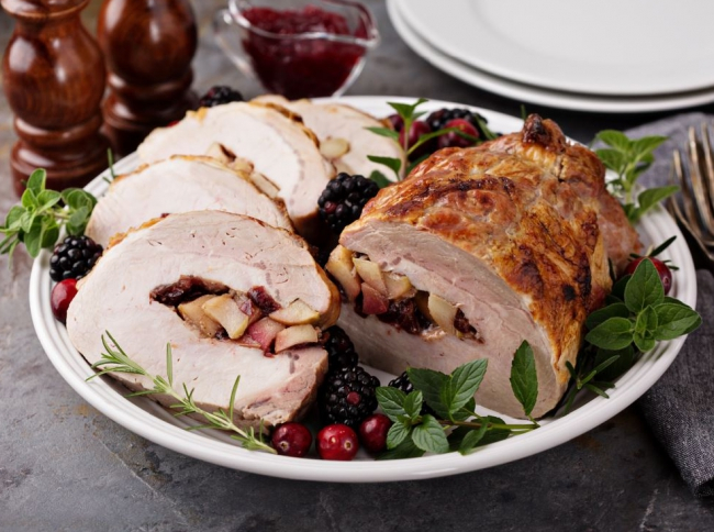Rolled pork roast with apple & cranberry stuffing