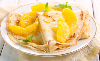 Dairy-free coconut crepes with orange sauce