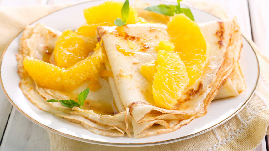Dairy-free coconut crepes with orange sauce