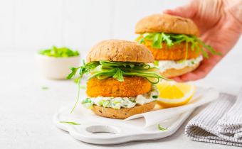 Fish,Burger,With,Cucumber,,Arugula,And,Mayonnaise,Sauce,,White,Background,