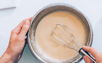Woman,Mixing,Batter,,Top,View.,Female's,Hands,Holding,Bowl,Whisking