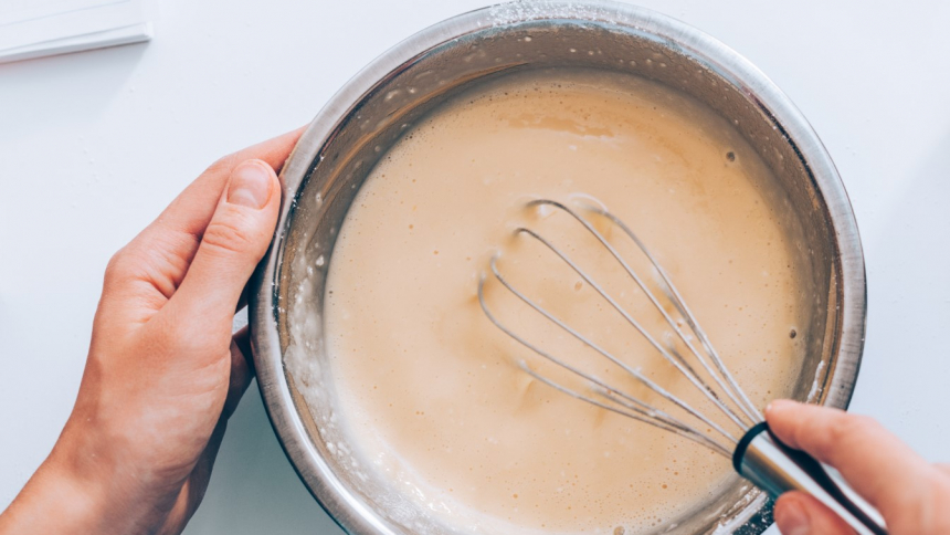 Woman,Mixing,Batter,,Top,View.,Female's,Hands,Holding,Bowl,Whisking